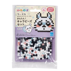 A package of colorful beads in the shape of a cartoon character, likely intended for use in bead art or crafts.