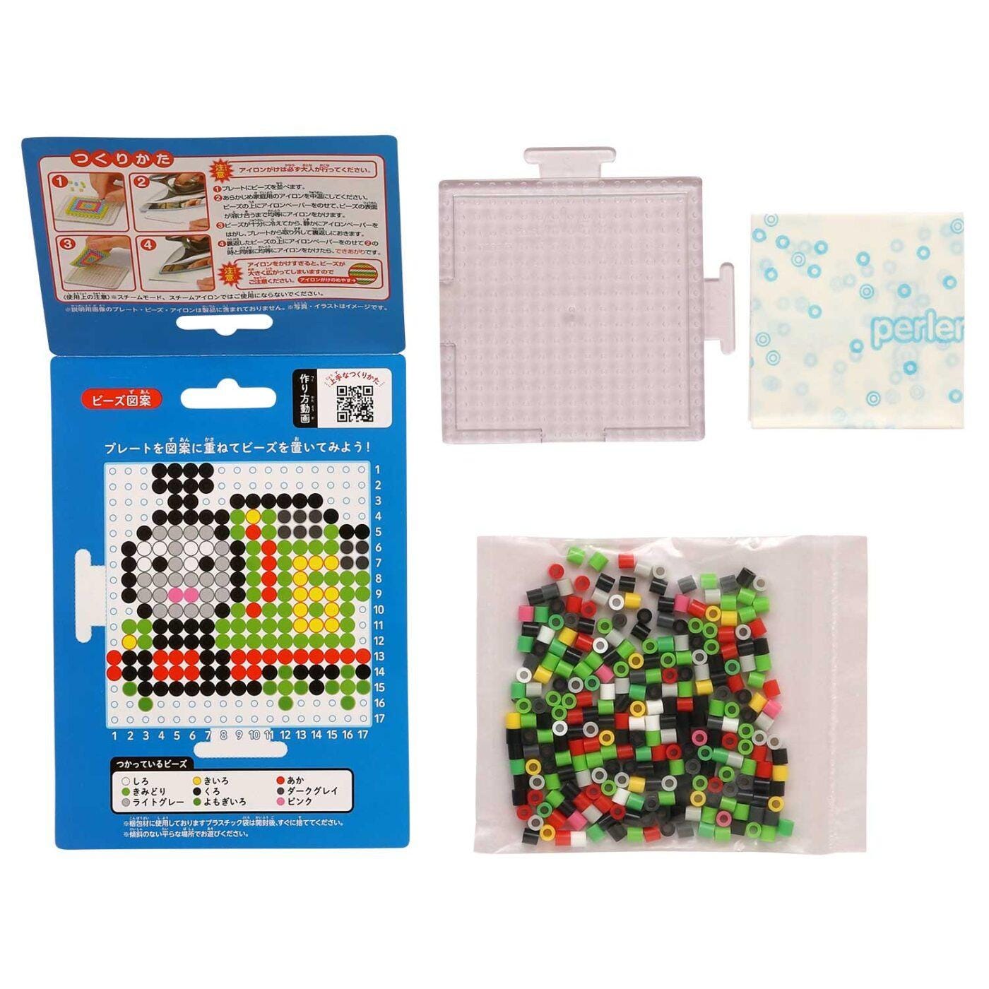 various items related to a craft or art project, including a blue box with instructions, a clear plastic container, and a bag filled with colorful beads.