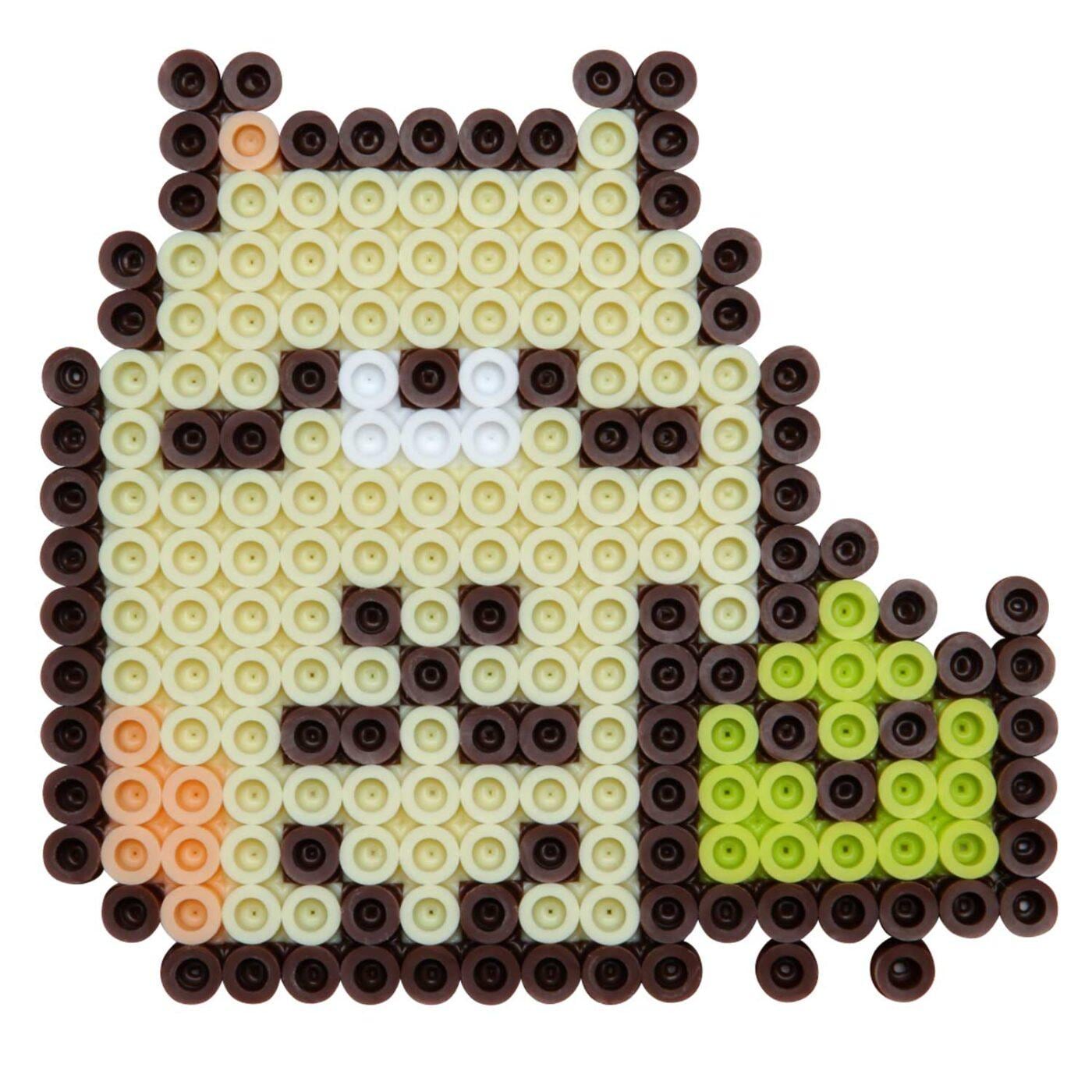 A pixelated character composed of small circular beads in various colors, including yellow, green, and brown.