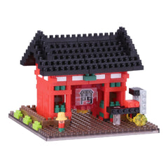 Assembled nano building block gate with red walls, black roof, green trim and steps