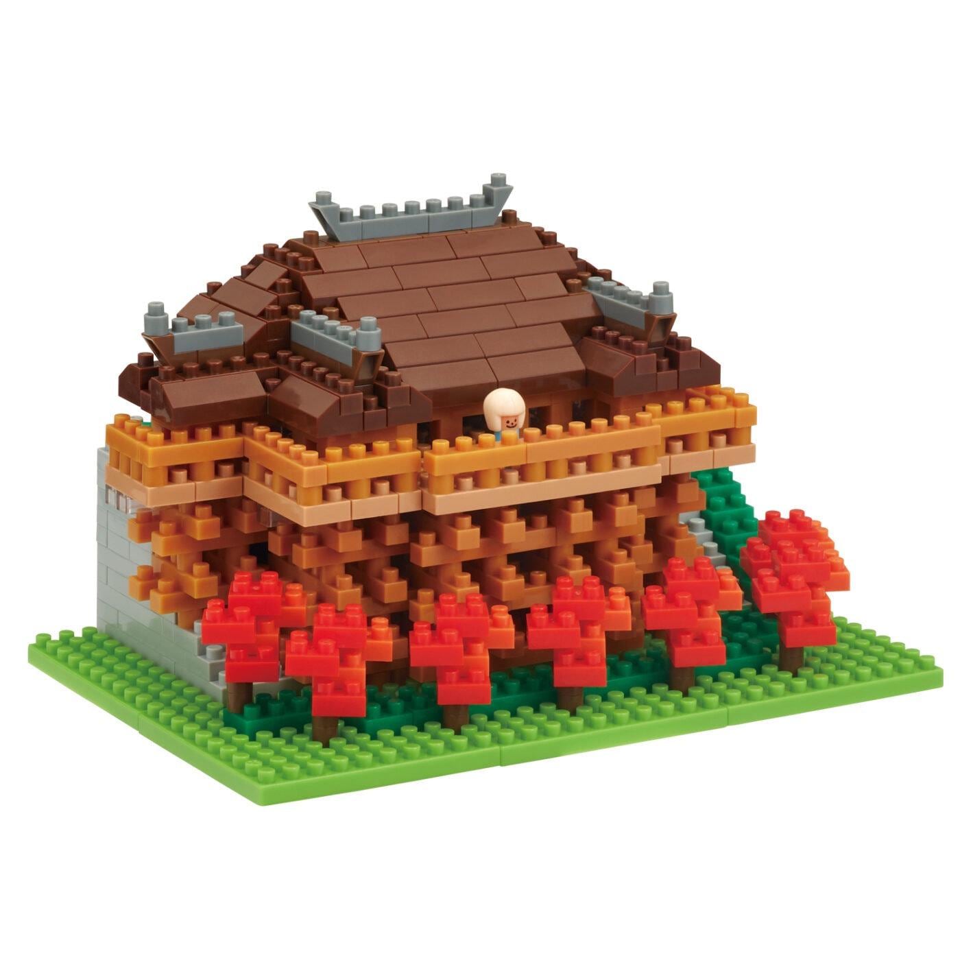 Brown temple model with red flower courtyard, green base, and small gray details