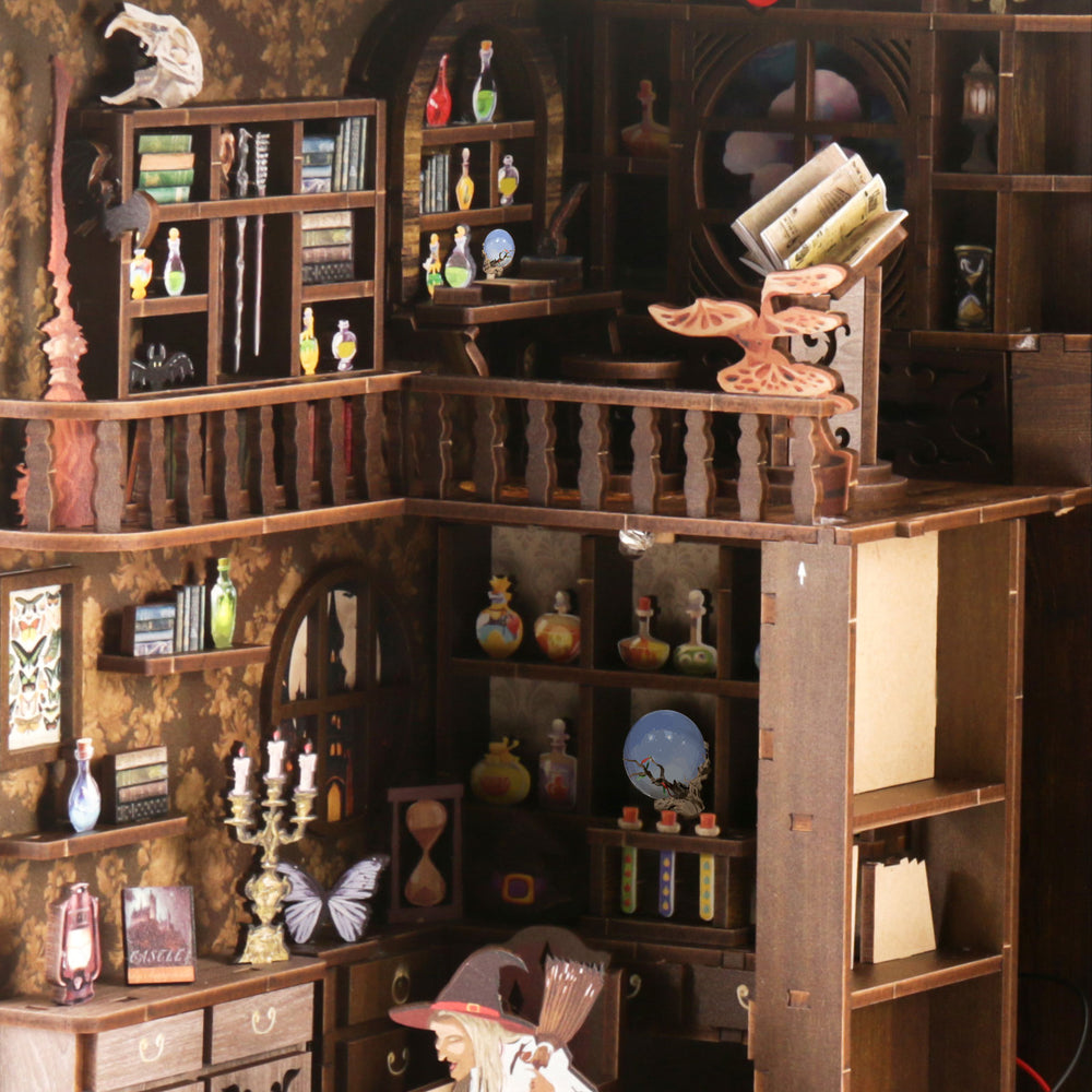 Wooden book nook diorama with open book, balcony rail, and potion shelves