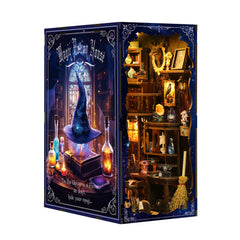 Book nook house kit with wizard-themed interior, glowing blue candles and shelves