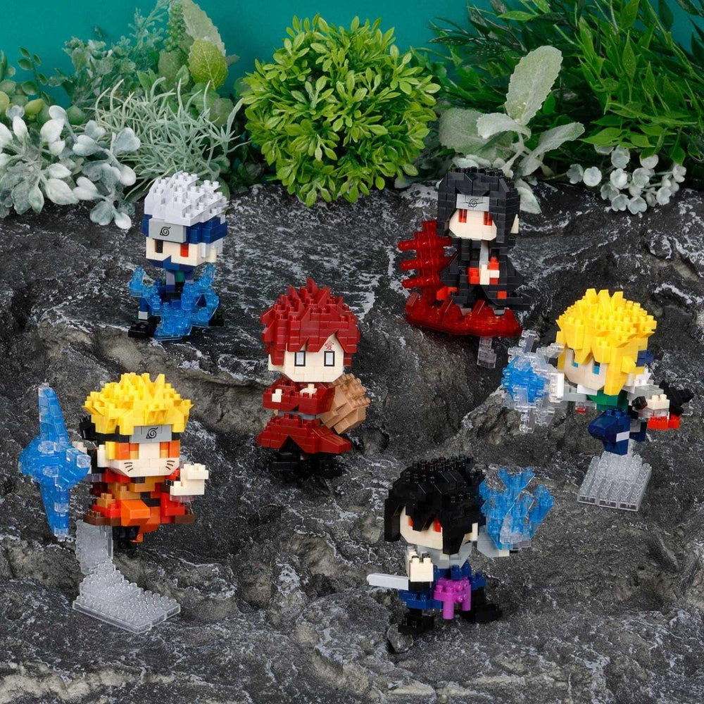DIY nano building blocks character set on gray rock with blue, red, yellow figures