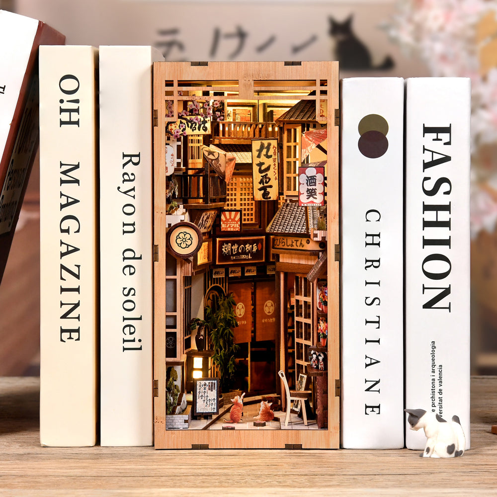 Miniature alley storefront DIY book nook kit with side panels and small cat figurine