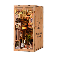 Wooden DIY book nook kit cabinet panel with illustrated storefront view