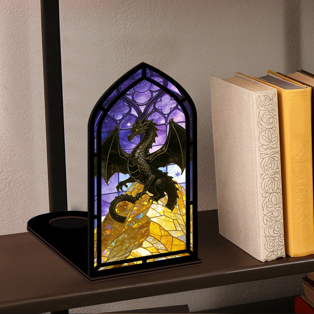 Dragon stained-glass arch book nook on shelf with dark frame and purple-gold art