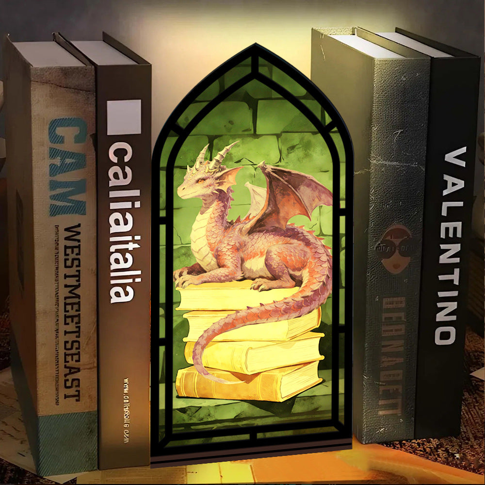 Dragon book nook centerpiece: black arched frame with purple dragon on stacked books