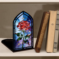 Black arched book nook display with stained-glass red rose and green leaves