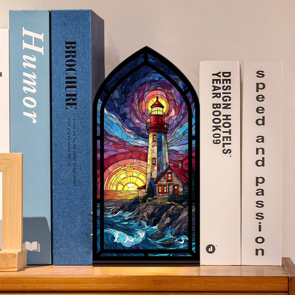 Coastal lighthouse book nook with stained-glass lighthouse panel between books