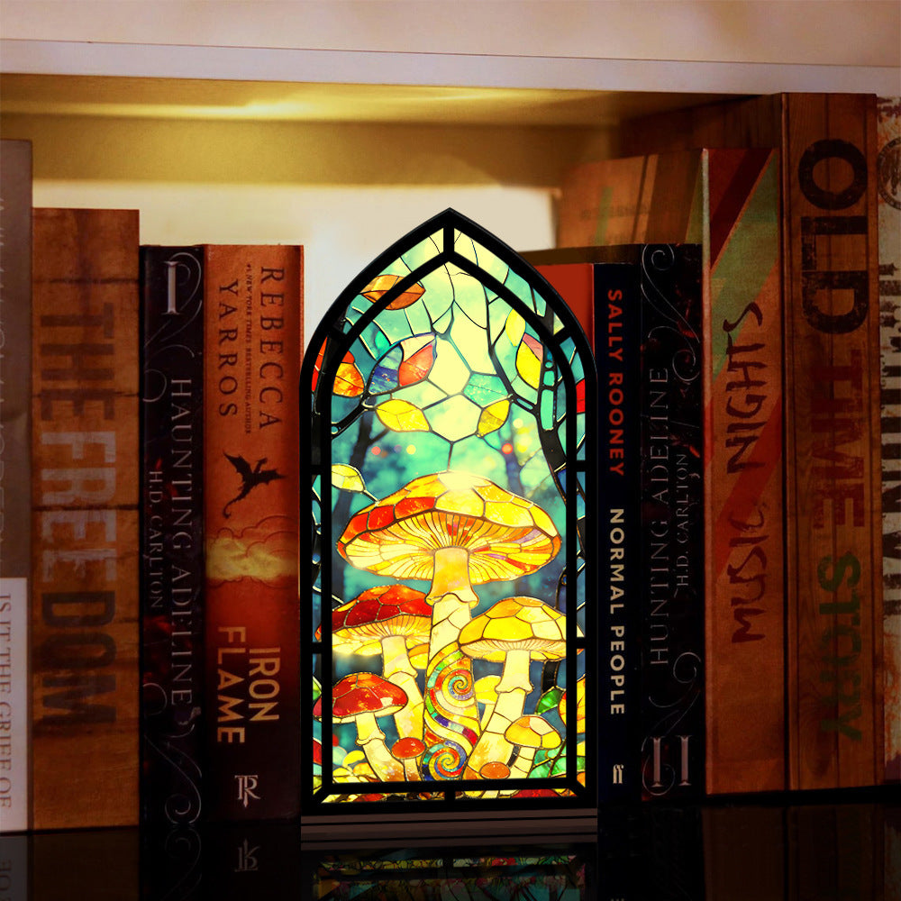 Mushroom stained-glass book nook with arched black frame and multicolor mushroom scene panel