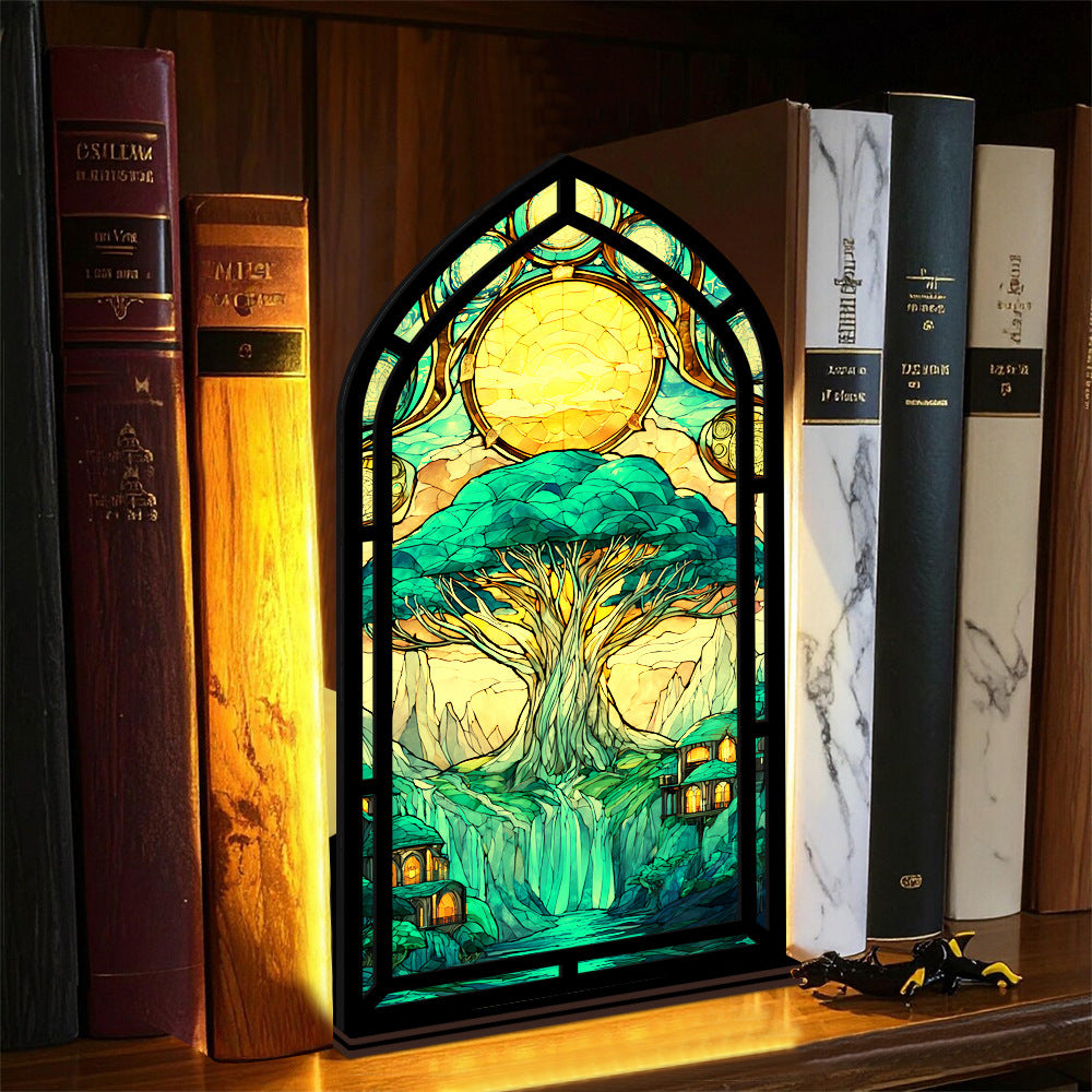 Tree-of-life book nook display with arched stained-glass tree artwork, front view
