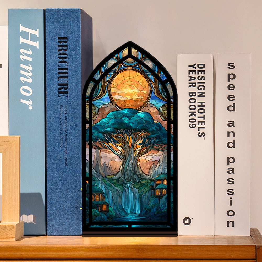 Tree-of-life book nook display with arched stained-glass style tree artwork