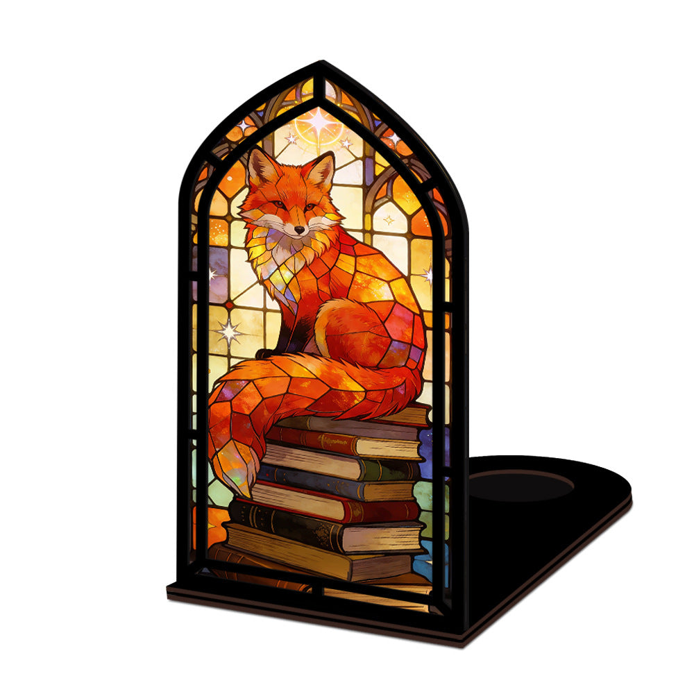 Arched fox book nook with stacked books and warm glowing interior, tabletop design