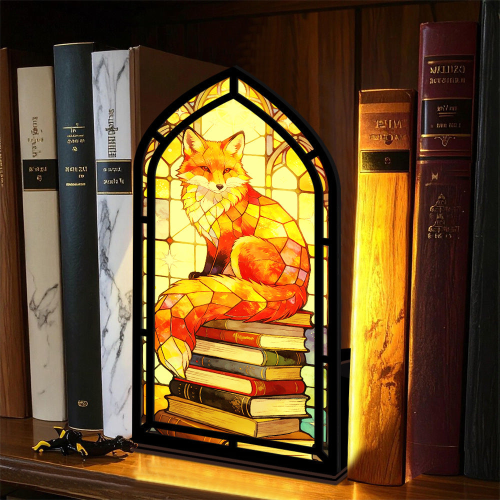 Arched fox book nook with stacked books and warm candle-lit glow on shelf