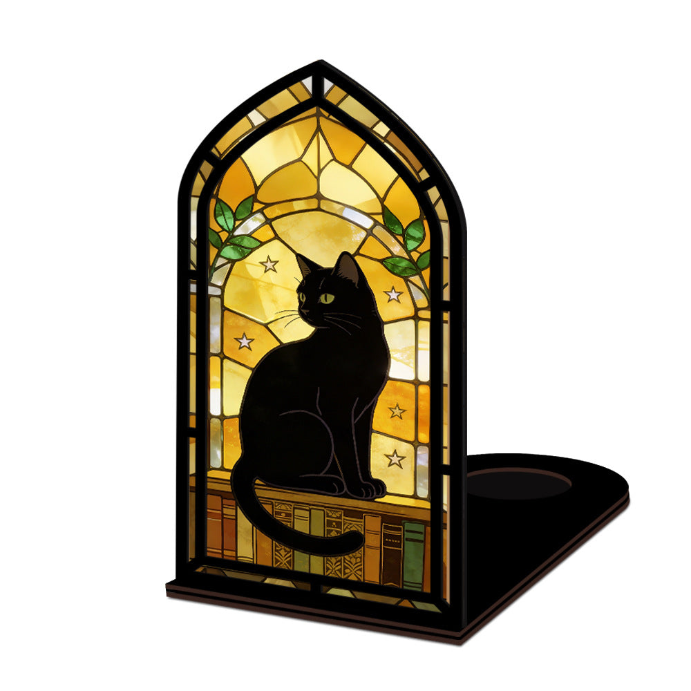 Standalone arched black cat book nook with warm glowing stained-glass window